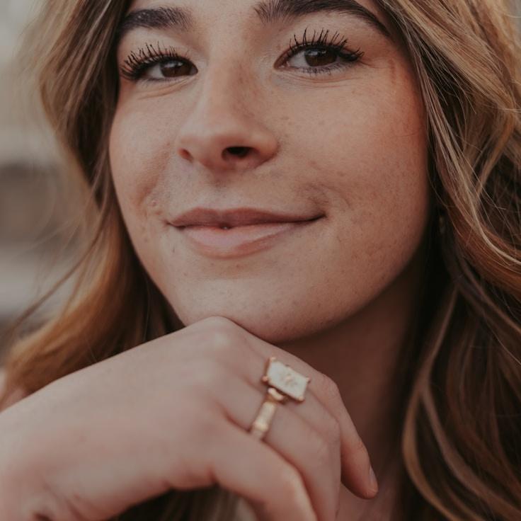 Kaveri Mehta, Lead Design Curator at FreshStationChart, reviewing corporate floral arrangements